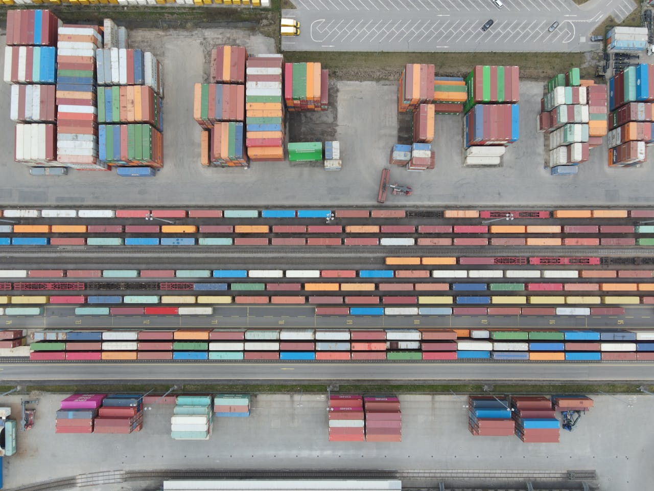 hero-img-02 Aerial shot of stacked cargo containers at Regensburg port showcasing freight transport activity.